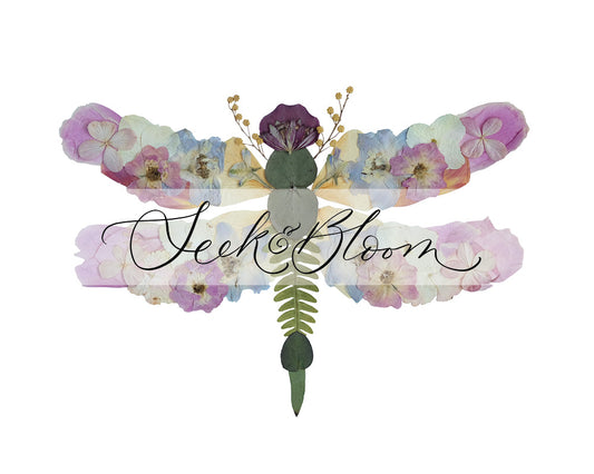 pressed flower botanical dragonfly artwork with pink, white and blue flowers and greenery.
