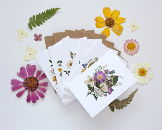 Set of greeting cards with floral designs on a white background with flowers and leaves.
