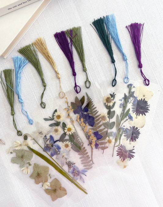 Pressed flower bookmarks with real dried flowers in clear laminate and colourful tassles