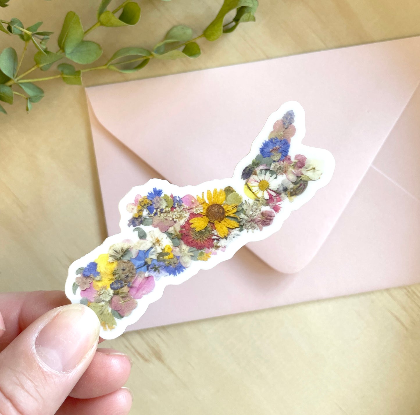 sticker of nova scotia map made with pressed flowers grown in NS.
