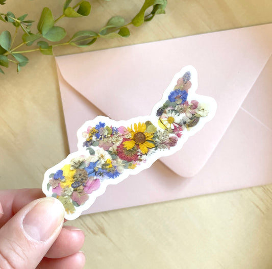 sticker of nova scotia map made with pressed flowers grown in NS.