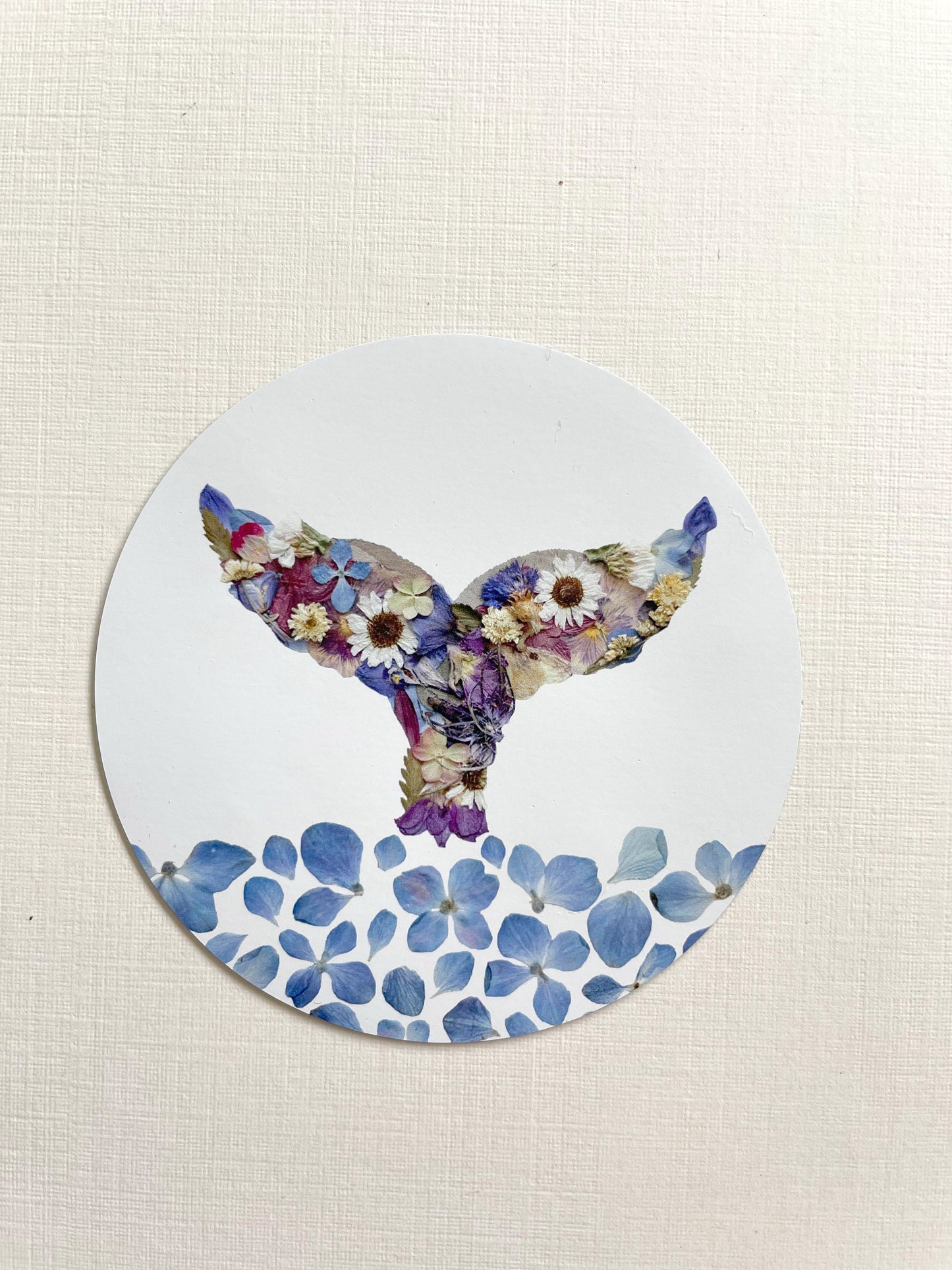 whale themed magnet made with blur and white and purplepressed flowers with water made with blue hydrangea blossoms