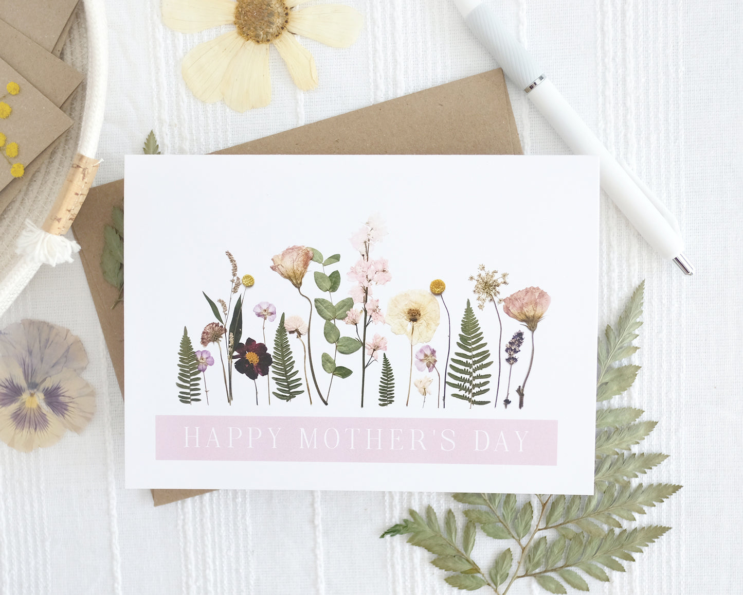 happy mothers day card of local garden flowers pink and purple