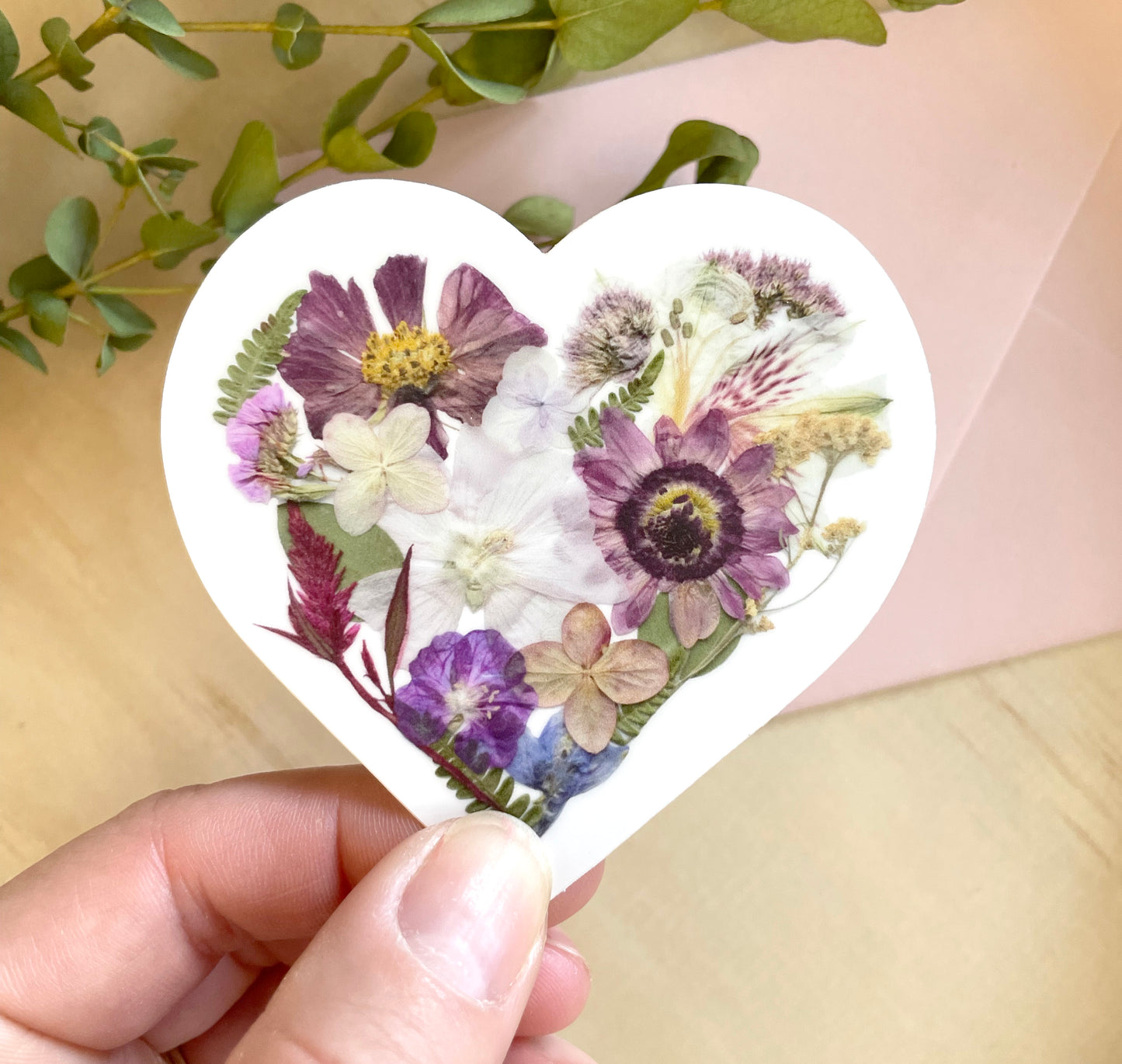 sticker of floral heart made with dried pressed flowers.