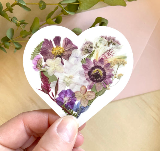 sticker of floral heart made with dried pressed flowers.