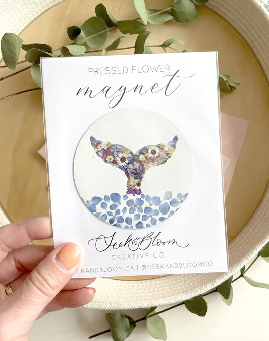 whale themed magnet made with blur and white and purplepressed flowers with water made with blue hydrangea blossoms