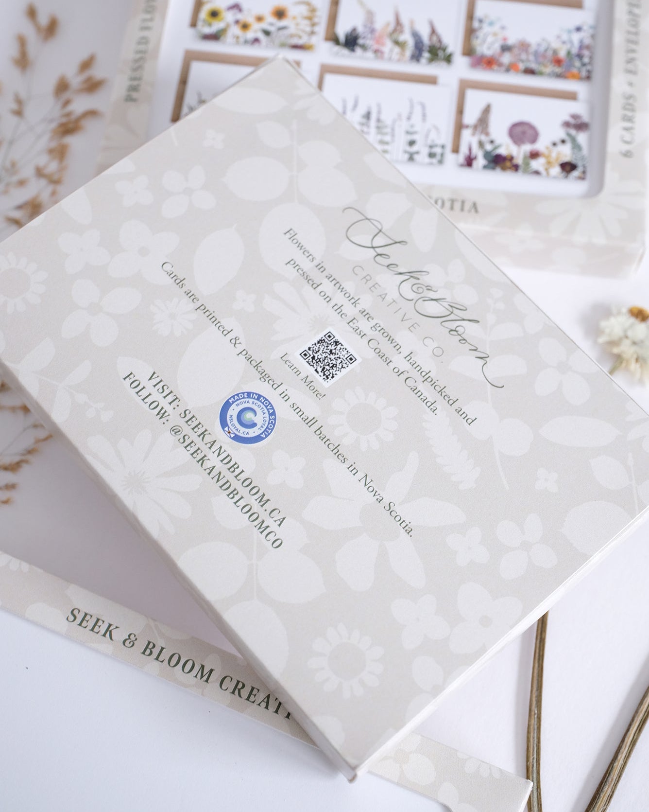 Product packaging with floral design and text on a white background