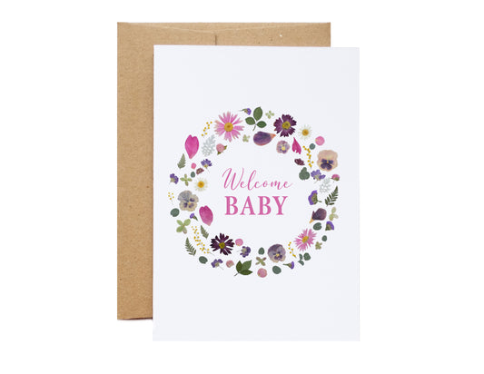 welcome baby card with pink and purple pressed flowers