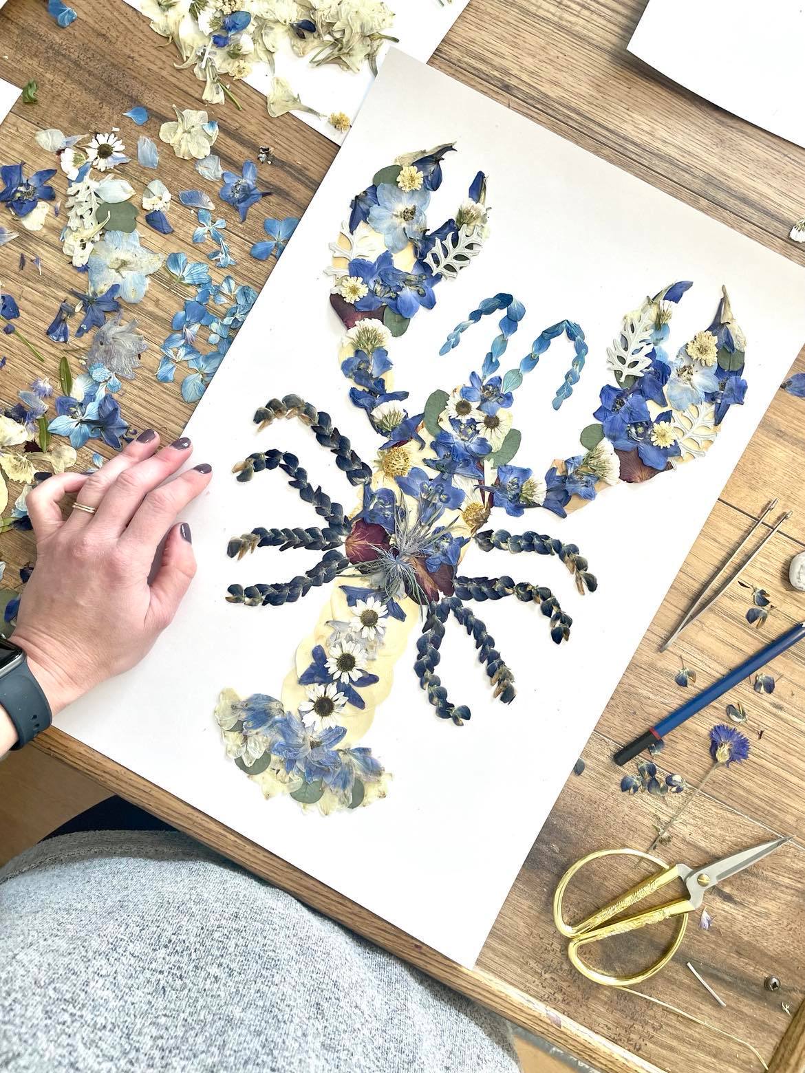 pretty Blue lobster artwork artistic design made with pressed flowers nova scotia lobster