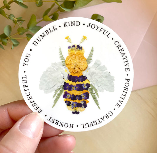 sticker of floral bee made from real dried flowers, yellow and purple bee design, bee humble, bee kind, bee creative bee quotes