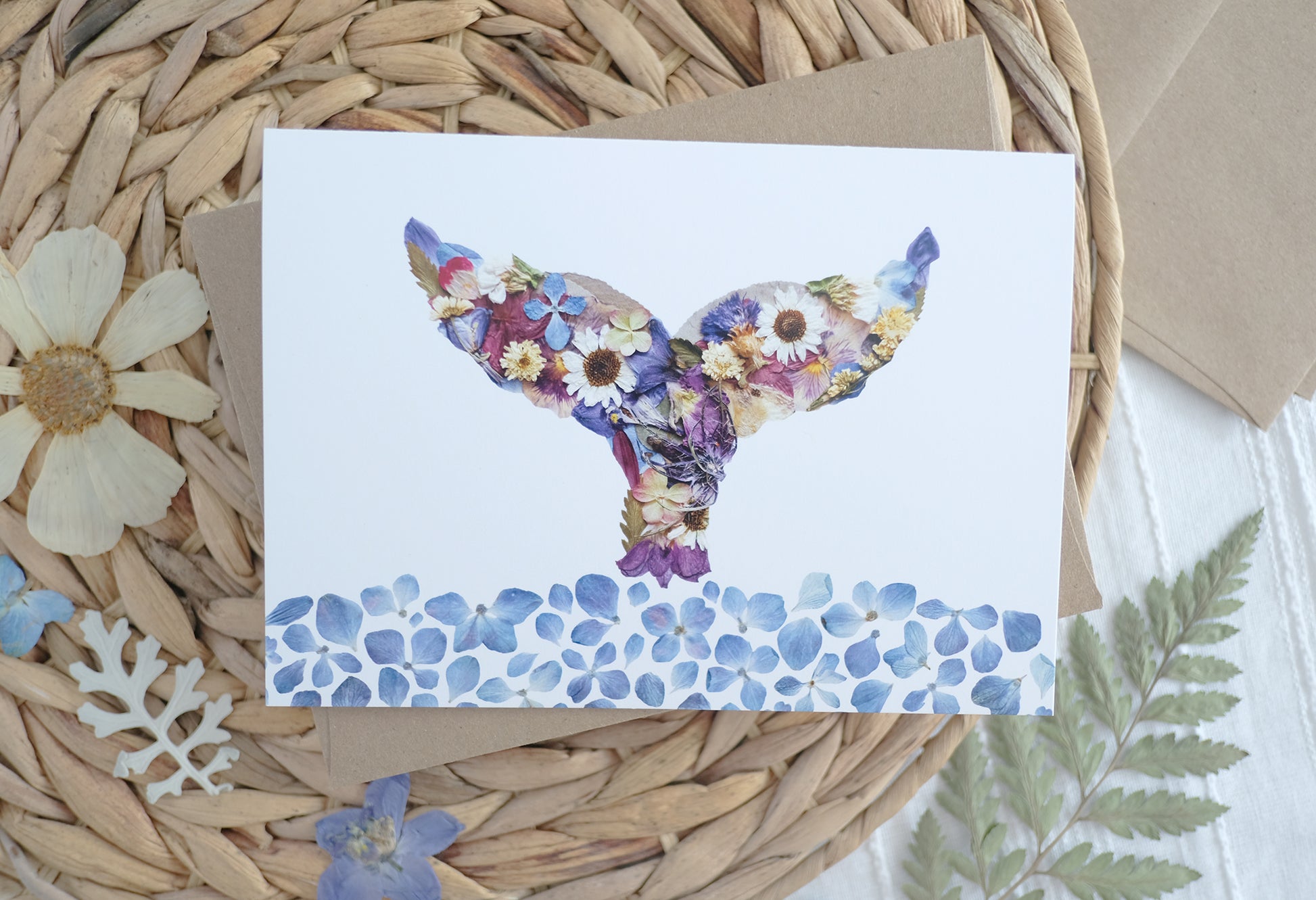 Cute Pressed flower whale tail in the ocean, everyday blank greeting card perfect for any occasion.