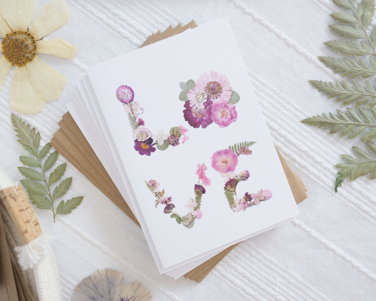 cards that say LOVE beautifully written in link and greenflowers