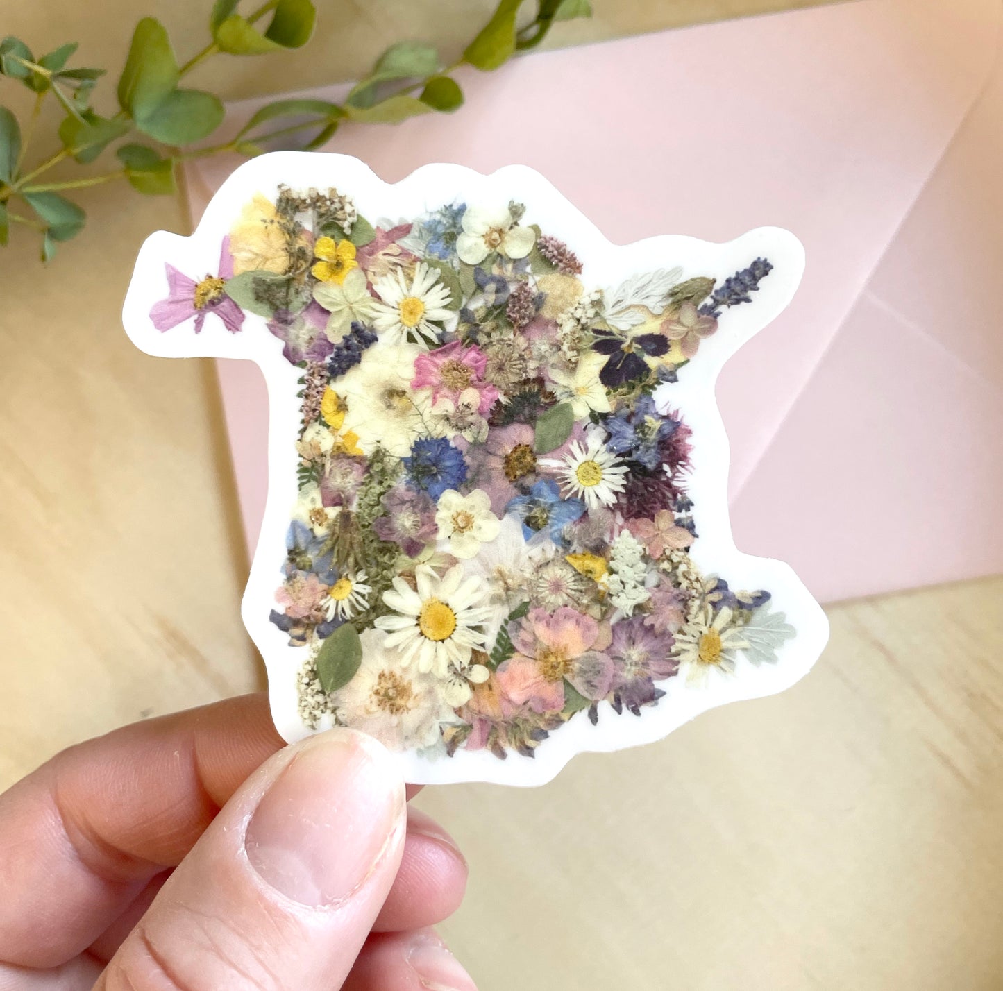 sticker of new brunswick map made with dried pressed flowers.