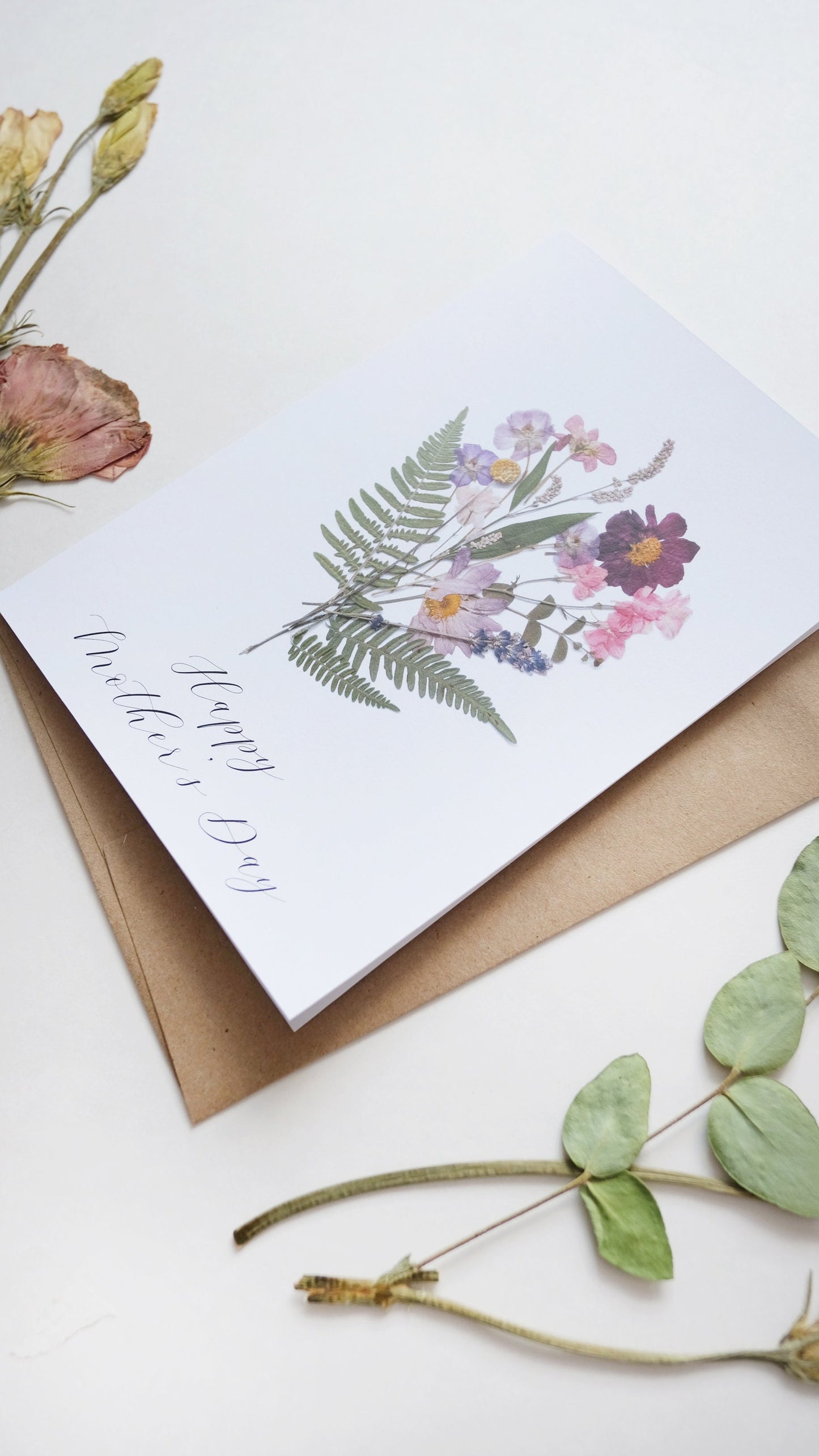 happy mother's day card with pretty natural bouquet of flowers